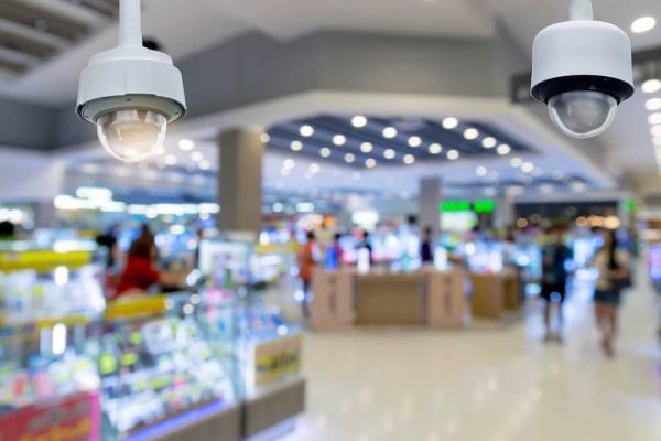 closeup-cctv-security-camera-on-blurred-inside-shopping-mall-background-otpvqk3l9e5f6on3fl5l6zs6sgogjl1e38lh3yhv34